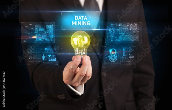 Fototapeta Businessman holding a light bulb, online security concept