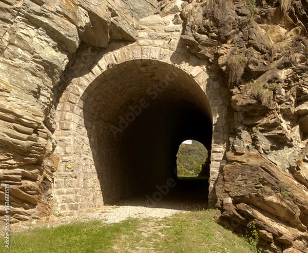 Fototapeta Tunnel on the valley walk, a disused railway line near Mesocco, Swiss Alps