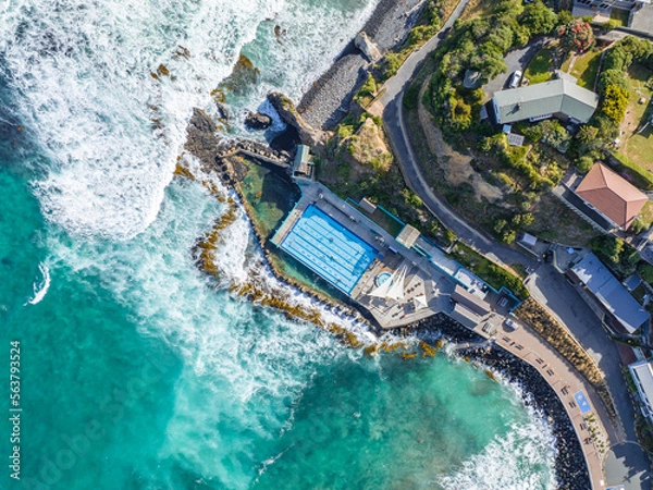 Obraz Beautiful high angle bird's eye aerial drone view of a hot salt water pool and the ocean in St Clair, a beachside suburb of Dunedin, the second-largest city in the South Island of New Zealand.