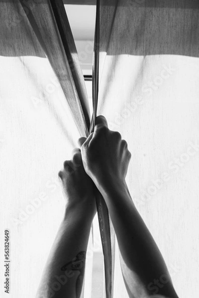 Obraz Close up hands closing curtains monochrome concept photo. Privacy. First-person view photography with window on background. High quality picture for wallpaper, travel blog, magazine, article