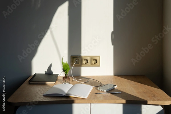Fototapeta desktop with nice shadow and blurred foreground. home office for freelance work. 