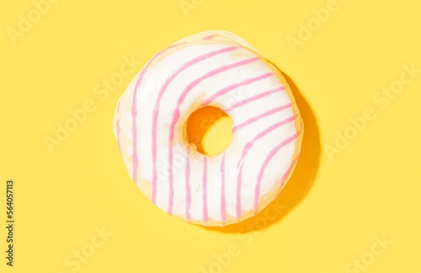 Obraz Delicious glazed donut on yellow background