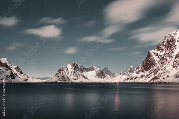 Fototapeta Unbelievable conditions in Lofoten, Norway. Playing lights, sun with clouds with mountains, amazing epic scenery during sunset 
