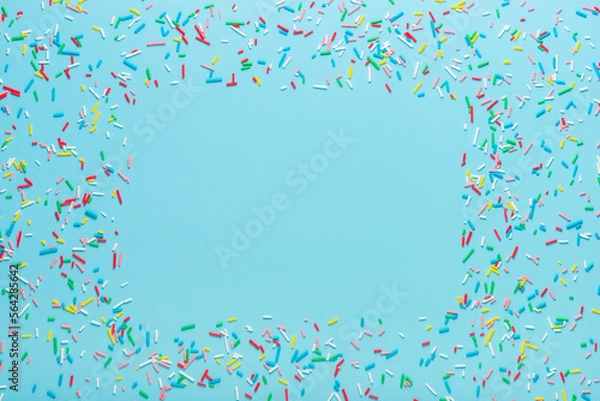 Obraz greeting wreath of colorful sprinkles on blue background, festive invitation for Valentines day, birthday, holiday and party time