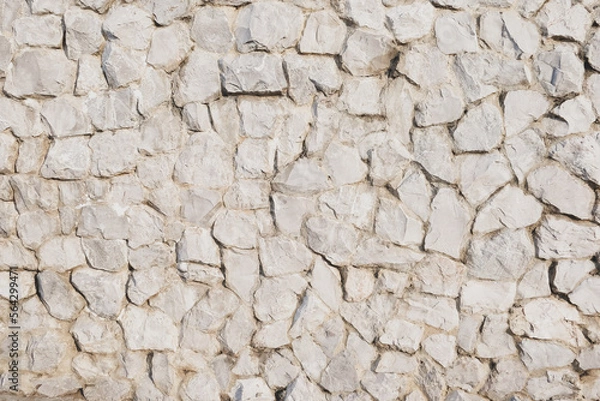 Fototapeta masonry wall texture. stones and rocks of different shape background