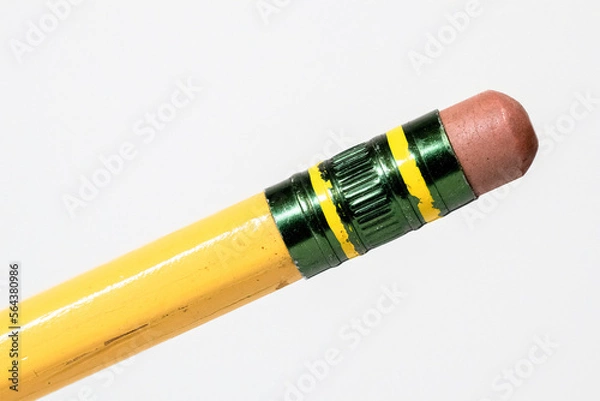 Fototapeta Macro closeup of aged worn pencil eraser isolated white background