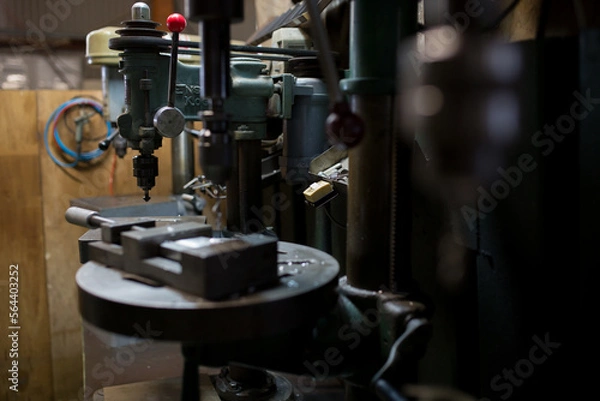 Fototapeta Part machining with drilling machine