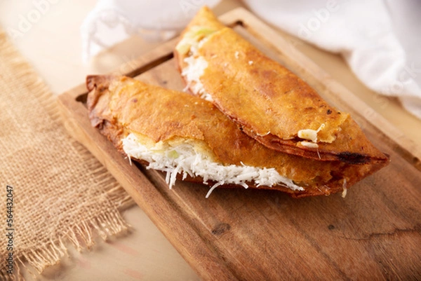 Fototapeta Quesadillas fritas. Traditional Mexican appetizer "garnacha"..Deep Fried handmade corn tortilla that can be filled with a wide variety of ingredients, cheese, pork rinds, meat, etc.