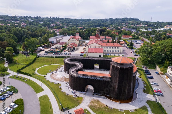 Fototapeta Wieliczka, Lesser Poland. Salt mine, graduation tower, railway station and other popular buildings and architecture on a sunny day in Wieliczka.