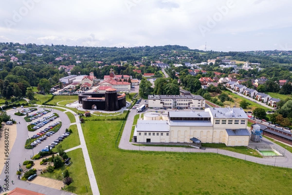 Fototapeta Wieliczka, Lesser Poland. Salt mine, graduation tower, railway station and other popular buildings and architecture on a sunny day in Wieliczka.
