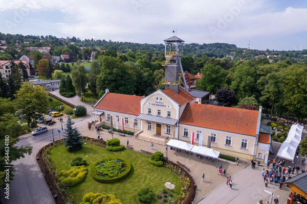 Fototapeta Wieliczka, Lesser Poland. Salt mine, graduation tower, railway station and other popular buildings and architecture on a sunny day in Wieliczka.