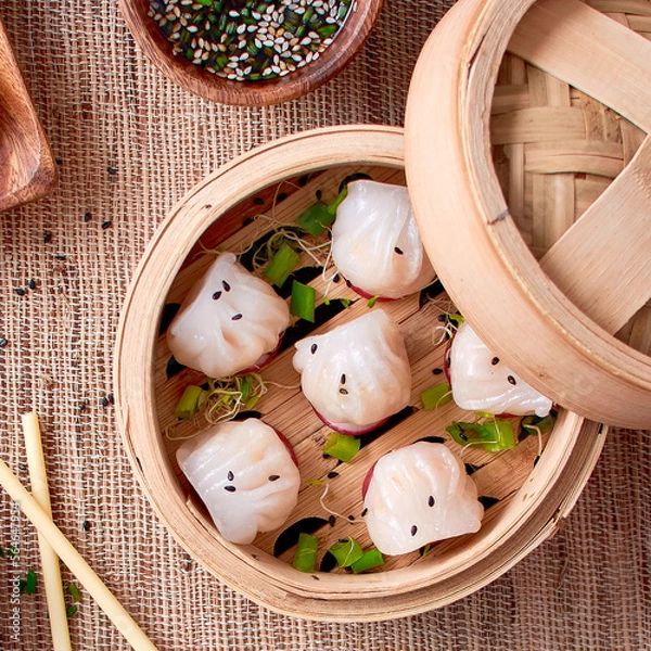 Fototapeta Dim sum in bamboo bowl, top view