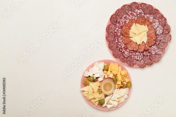 Fototapeta Different tasty snacks for party on wooden background, top view