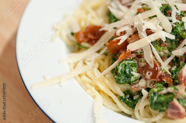 Obraz Pasta dish with spinach, bacon and parmesan
