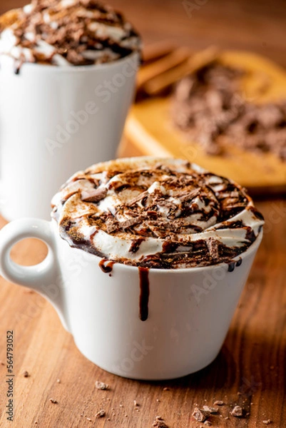Fototapeta Hot chocolate. Irish coffee or spiked hot chocolate. Classic holiday drink made with hot coffee, Irish cream flavored liquor, mocha, Kahula, chocolate and topped with whipped cream and a cherry.