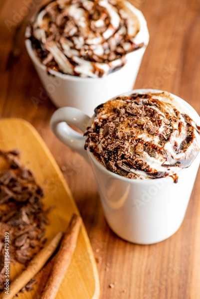 Fototapeta Hot chocolate. Irish coffee or spiked hot chocolate. Classic holiday drink made with hot coffee, Irish cream flavored liquor, mocha, Kahula, chocolate and topped with whipped cream and a cherry.