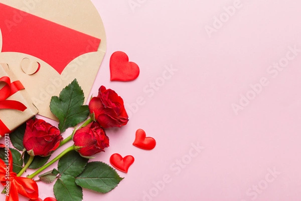 Fototapeta Valentine day composition with envelope, rose flower and red heart on table. Top view, flat lay, copy space Holiday concept
