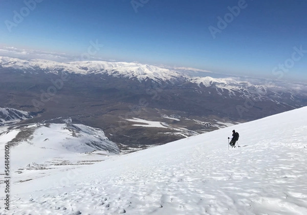 Fototapeta Mountaineer going down on Mount Eznevit at Aladaglar Mountain Range in Nigde, Turkey. Aladaglar is most important mountain range in Turkey.