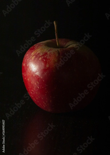 Obraz Red apple on black background