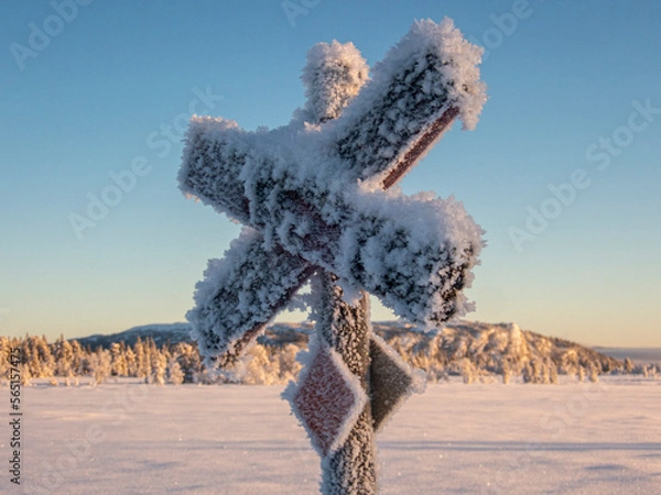Fototapeta Frozen crossing sign for snowmobile in scandinavia
