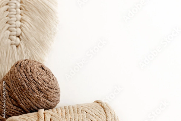 Fototapeta Macrame leaf. Cotton rope decor. handmade for home decoration. macrame braiding and cotton threads on white background.