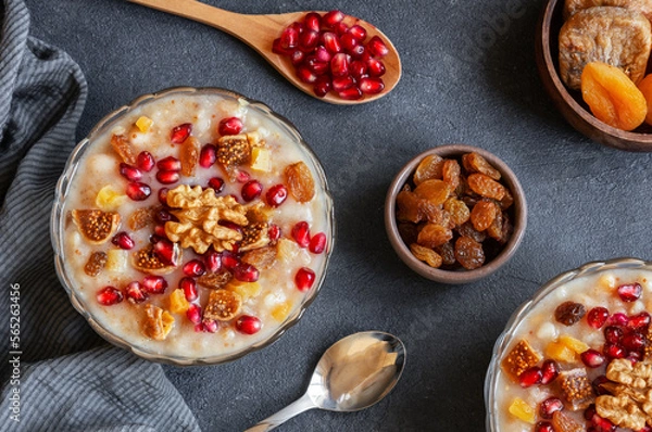 Fototapeta Traditional Turkish delicious mixed dessert, ashura (asure) with pomegranate seeds, walnut, apricot, Noah’s pudding