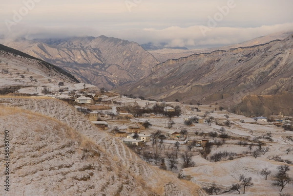 Fototapeta The aul is located on a mountainside in Dagestan and is covered with snow.