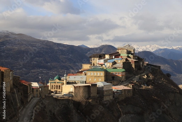 Fototapeta The bright and colorful village of Chokh against the backdrop of a mountain panorama in the Gunibsky district of Dagestan.