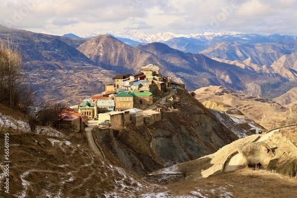 Fototapeta The bright and colorful village of Chokh against the backdrop of a mountain panorama in the Gunibsky district of Dagestan.