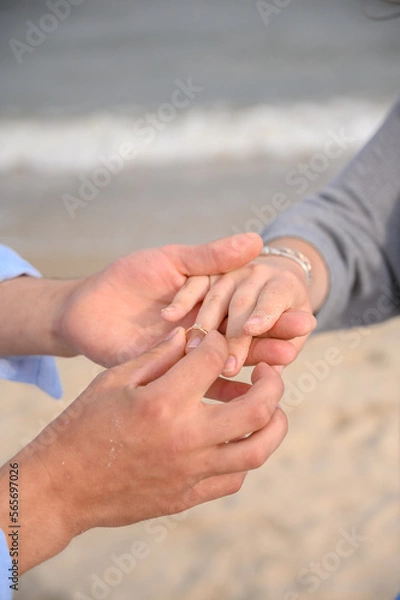 Fototapeta Wearing a ring at the engagement ceremony