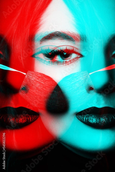 Fototapeta Portrait of beautiful woman with make-up and dark lips. Model looking at camera and holding make-up brush near her cheek. Red and blue channel color split effect applied. Futuristic looking style