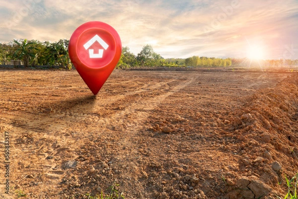 Fototapeta House symbol with location pin and Empty dry cracked swamp reclamation soil, land plot for housing construction project with and beautiful sunset sky with fresh air Land for sales landscape concept