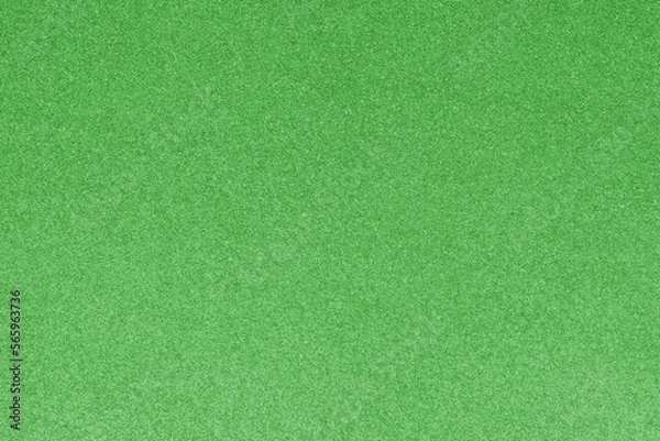 Fototapeta GREEN shimmering glitter material background with glowing effects