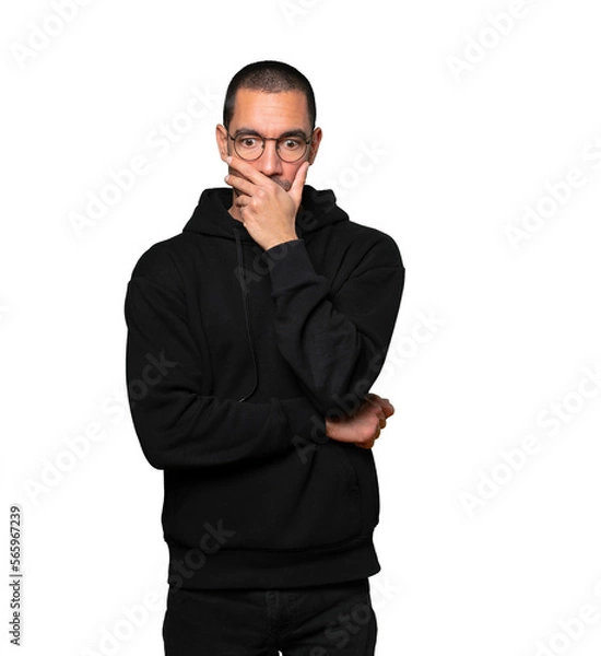 Obraz Concerned young man posing against background