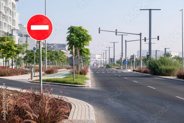 Fototapeta View of an empty beautiful street highway with entry prohibited traffic sign in the city