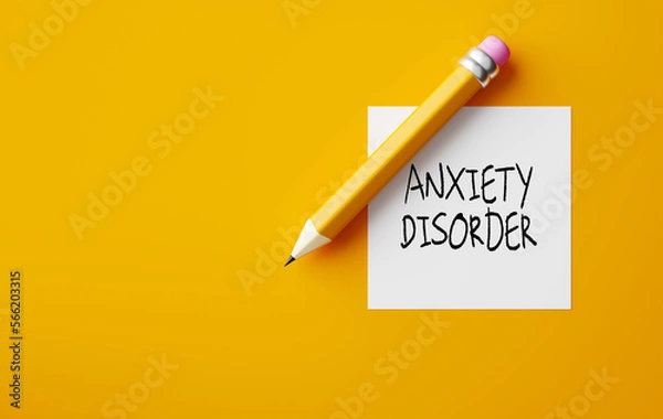 Fototapeta Pencil and a note paper with the word Anxiety Disorder on yellow background.