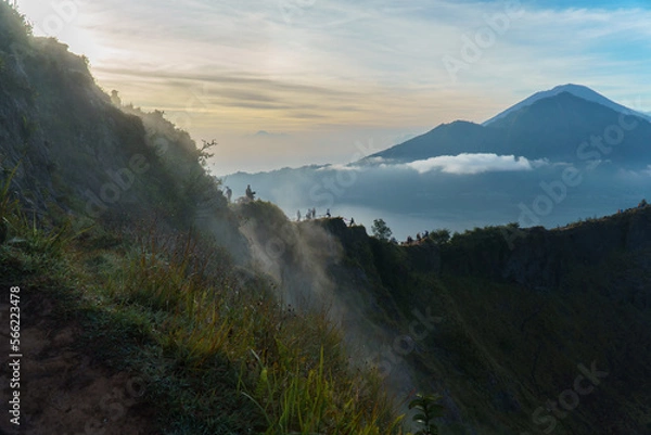 Fototapeta Incredible views from the top of Mount Batur, a volcano located on the island of Bali. In the background, very small you can see another volcano, the Agung.
