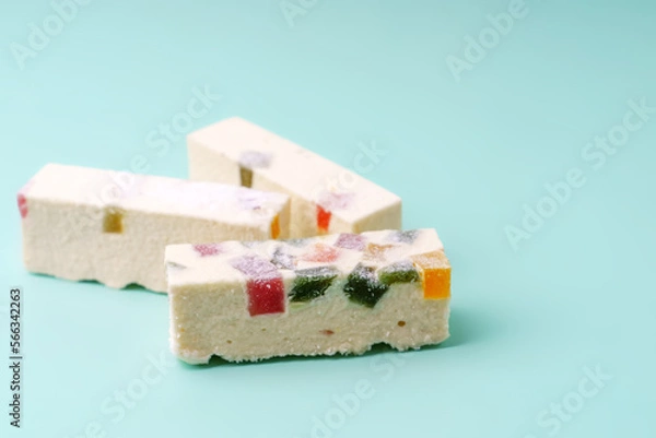 Fototapeta White pastille with multi-colored marmalade and candied fruits inside