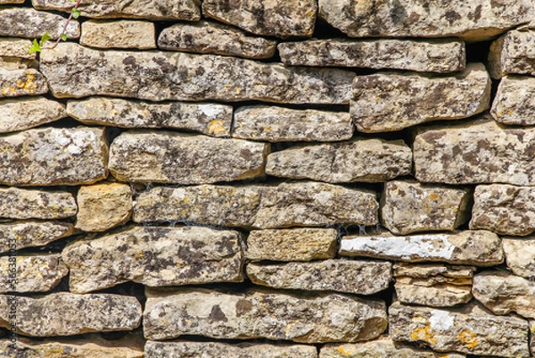 Obraz An old cobbled wall, stone masonry. Abstract natural backgrounds and textures