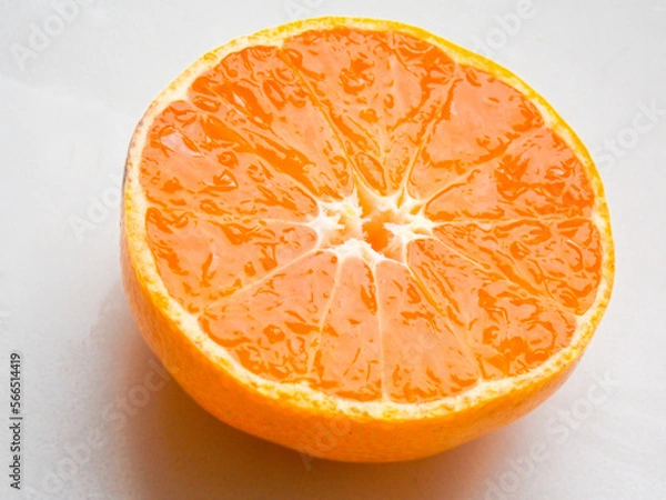 Obraz Orange on a white background. Cut in half