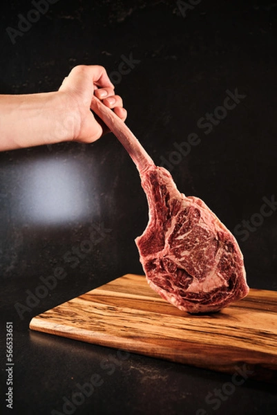 Obraz Toma hawk raw beef, hand holding