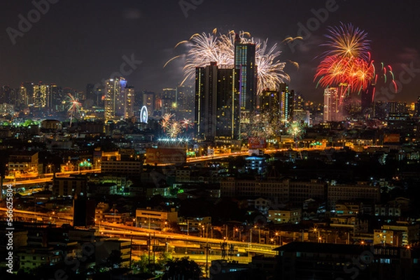 Obraz The blurred background of fireworks (light trails) is beautiful at night, seen in the New Year holidays, Christmas events, for tourists to take pictures during public travel.