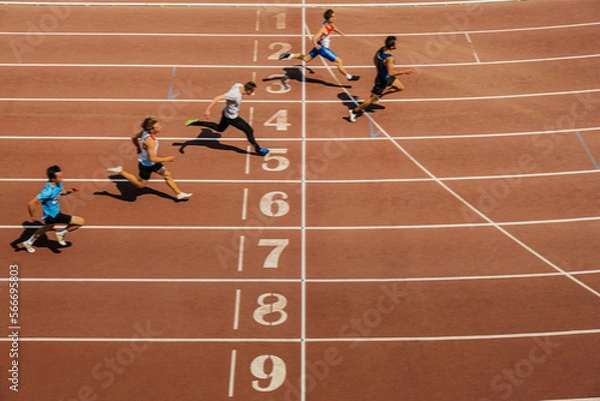 Obraz men runners sprint race finish motion blur