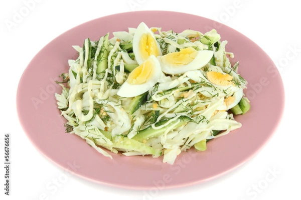 Fototapeta Delicious salad with eggs, cabbage and cucumbers, isolated
