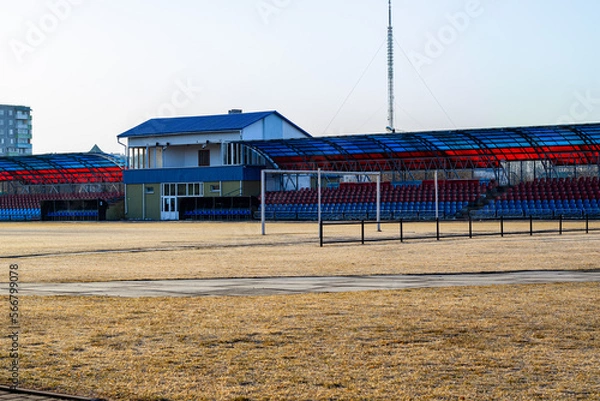 Fototapeta city small football stadium. organization of public space. Public amphitheater, empty seats in Smorgon, Belarus