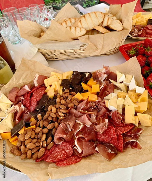 Fototapeta table setting with appetizers, plates, glasses