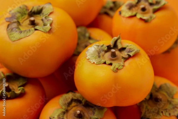 Obraz Delicious ripe juicy persimmons as background, closeup