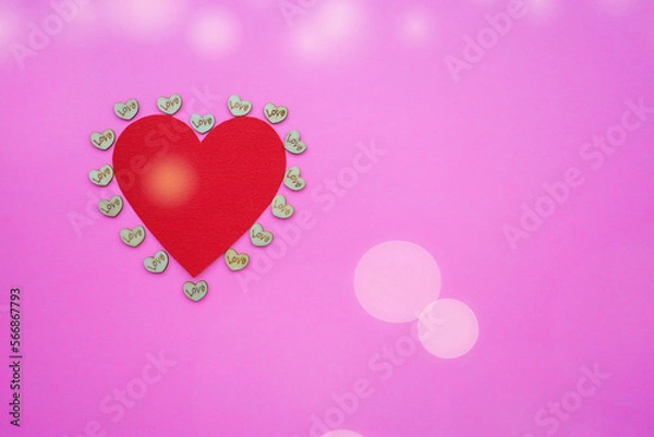 Fototapeta Red heart shape on abstract pink background in valentine's day love concept with sweet and romantic moment.