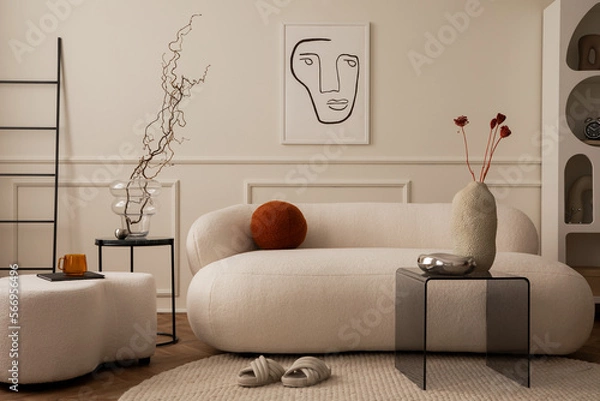 Fototapeta Cozy composition of living room interior with mock up poster frame, white sofa, round pillow, glass coffee table, beige wall with stucco, chrom bowl and personal accessories. Home decor Template.