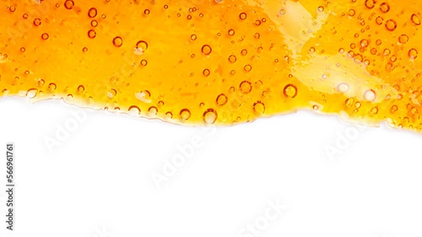 Fototapeta cannabis golden wax resin and white background with place for text